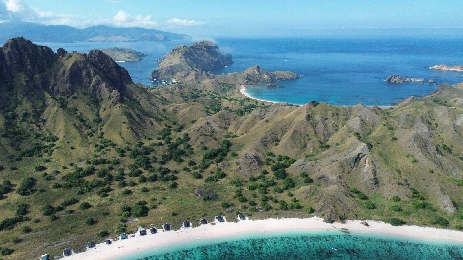 Padar – Aerial ridge, three bays, curved white beaches (Real photo from a Komodo Explorer trip)