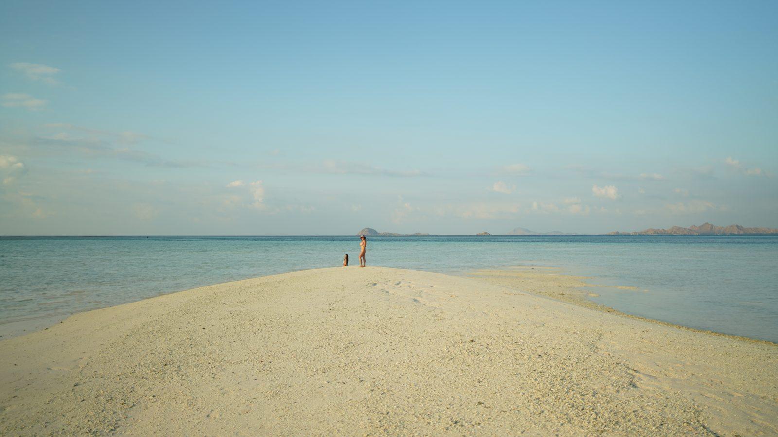 Taka Makassar – long white sandbar, sea, distant figure (Real photo from a Komodo Explorer trip)