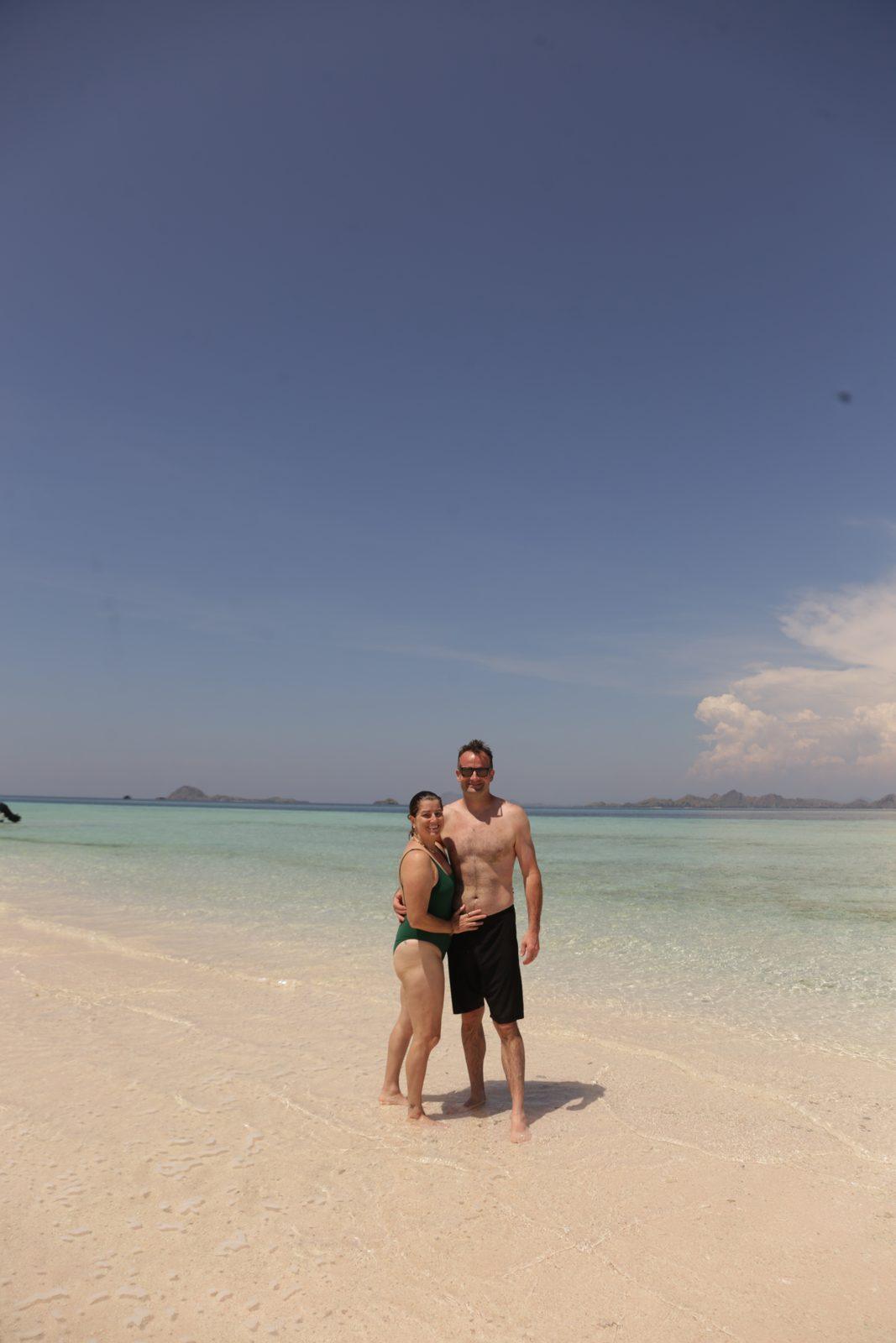 Taka Makassar – couple on sandbar, clear shallows (Real photo from a Komodo Explorer trip)