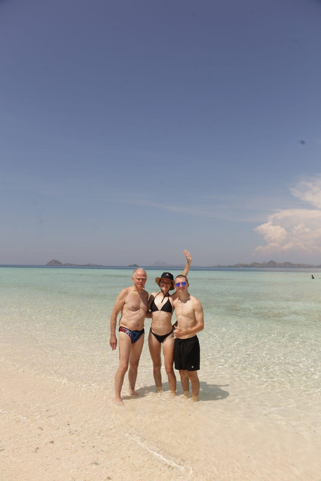 Taka Makassar – group on sandbar, arms raised (Real photo from a Komodo Explorer trip)