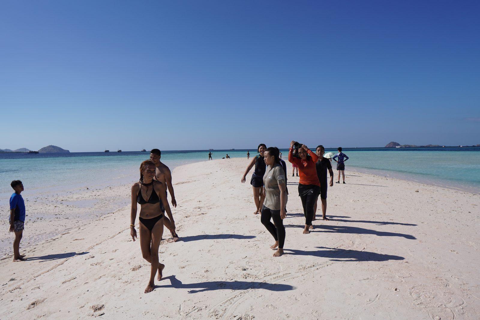 Taka Makassar – group walking on white sandbar (Real photo from a Komodo Explorer trip)